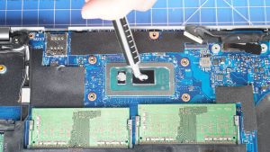 Apply a small amount of new thermal paste to the processors.