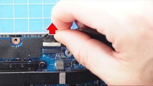 Unscrew the LCD cable bracket and disconnect the LCD cables (2 x M2 x 3mm).