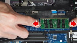 Separate the locking clips to release the RAM/Memory.