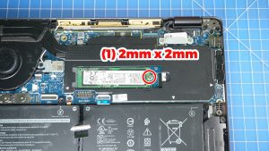 Unscrew and slide out the M.2 NVMe SSD/a