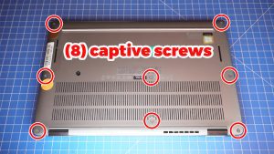 Use a plastic scribe to pry apart and remove the Bottom Base Cover.