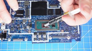 Apply a small amount of new thermal paste to the processors.