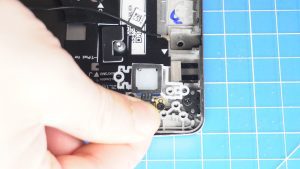 Unscrew and remove the power button (2 x 1.2mm x 1.5mm).