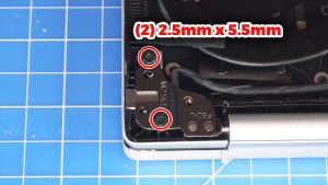 Unscrew and lift the left LCD hinge (2 x 2.5mm x 5.5mm).