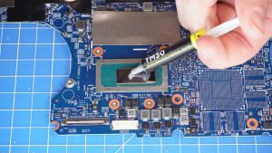 Apply a small amount of new thermal paste to the processors.