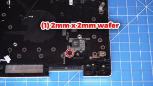 Unscrew and remove the power button board (2 x M2 x 3mm).