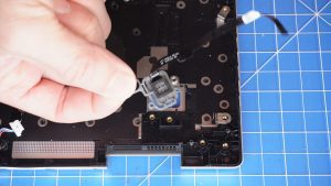 Unscrew and remove the power button board (2 x M2 x 3mm).