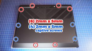 Use a plastic scribe to separate and remove the Bottom Base Cover.