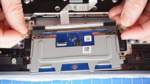 Unscrew and remove the Touchpad (7 x 