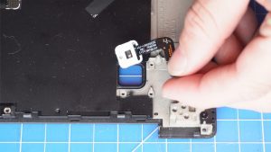 Unscrew and remove the power button bracket (3 x 1.6mm x 2mm).