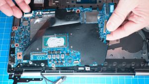 Unscrew and remove the Motherboard (2 x 