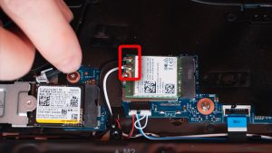 Disconnect the antenna cables and slide out the WiFi Card.