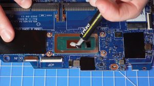 Apply a small amount of new thermal paste to the processors.