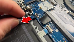 Unclip the locking tab and disconnect the hard drive cable.