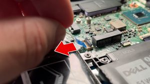 Unscrew and remove the hard drive and caddy (3 x M2 x 3mm).