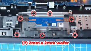 Unscrew and remove the bracket and Touchpad (7 x 