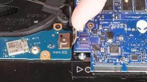 Unscrew and disconnect the I/O board cable that bridges the left I/O circuit board to the motherboard (1 x M2 x 3mm wafer).