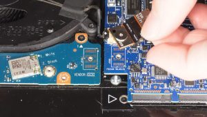 Unscrew and disconnect the I/O board cable that bridges the left I/O circuit board to the motherboard (2 x M2 x 3mm wafer).