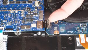 Unscrew and disconnect the I/O board cable that bridges the right I/O circuit board to the motherboard (1 x M2 x 3mm wafer).