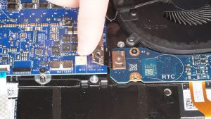 Unscrew and disconnect the I/O board cable that bridges the right I/O circuit board to the motherboard (1 x M2 x 3mm wafer).