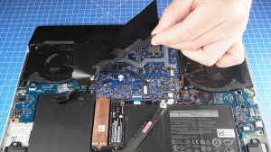 Peel off the adhesive covering from the motherboard.