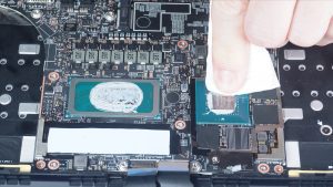 BEFORE REPLACING HEATSINK: Wipe away any old thermal paste from the processors and heatsink.