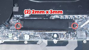 Unscrew and remove the thermal bracket to expose the SSD (2 x M2 x 3mm).