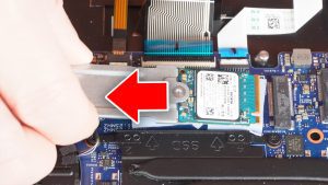 Unscrew and remove the SSD (1 x M2 x 3mm).